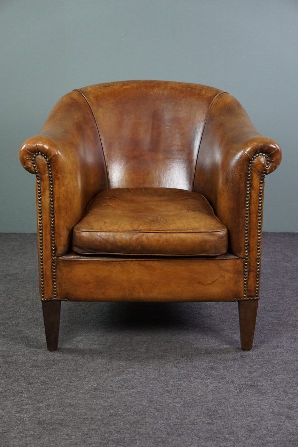 Club chair in patinated sheepskin