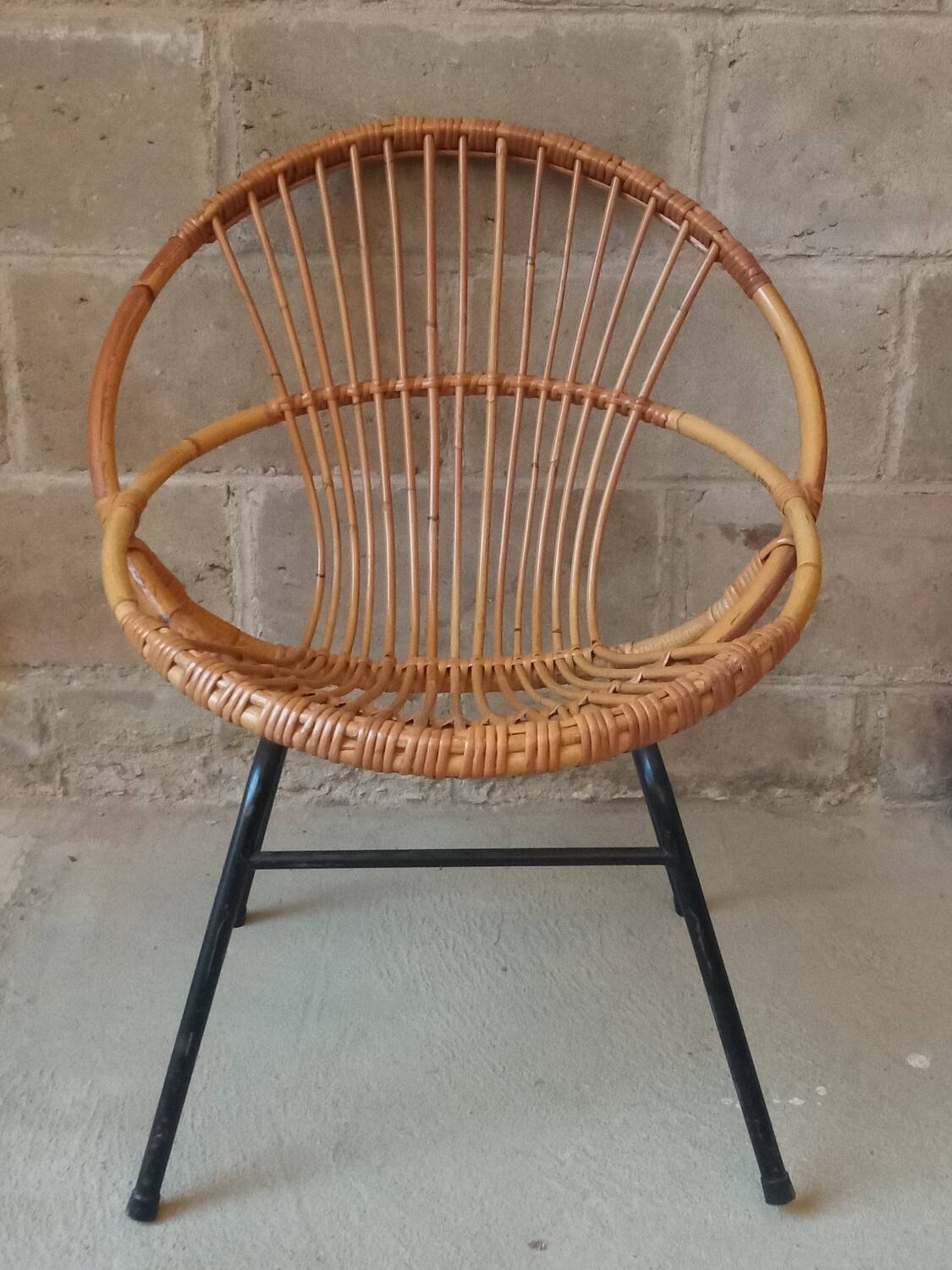 Rattan armchair with metal base from the 1950s
