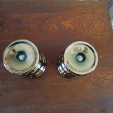 Two bronze-colored candlesticks