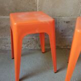 Pair of AMI stools in orange plastic