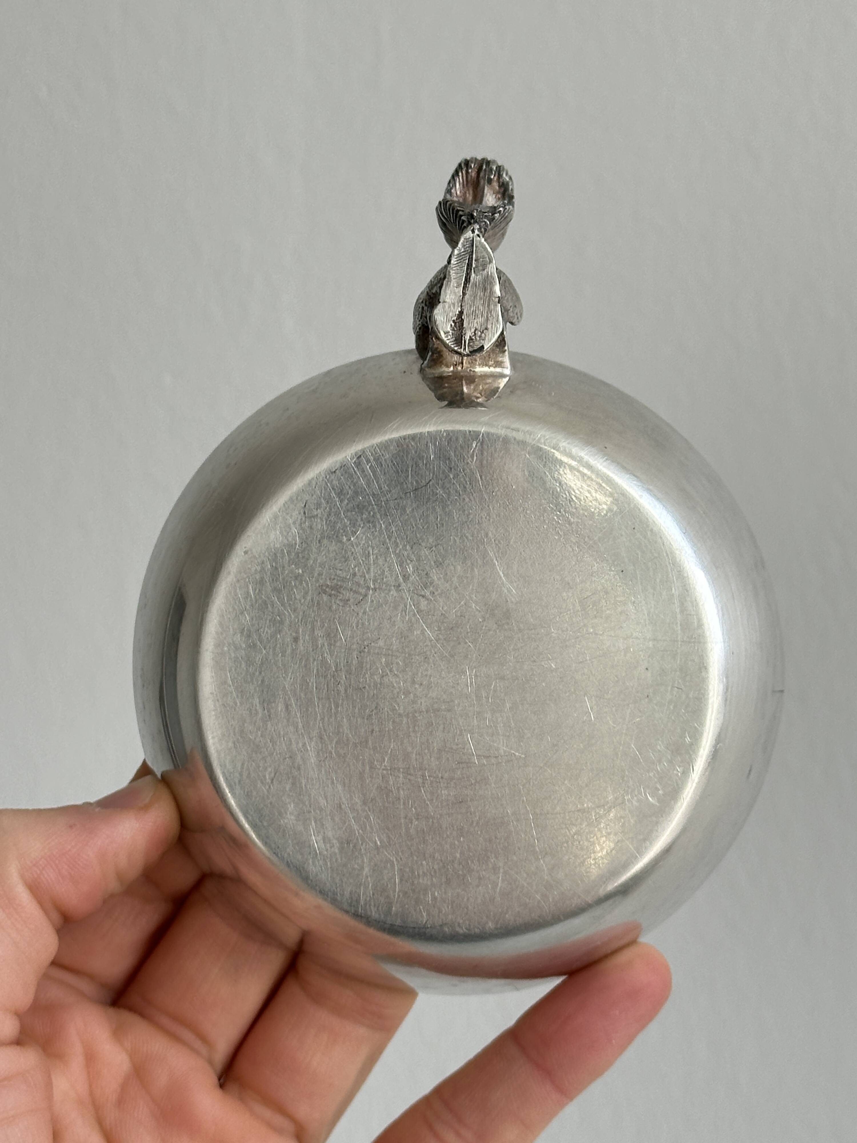 Metal cup with squirrel