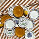 Set of twelve mismatched vintage dessert plates.