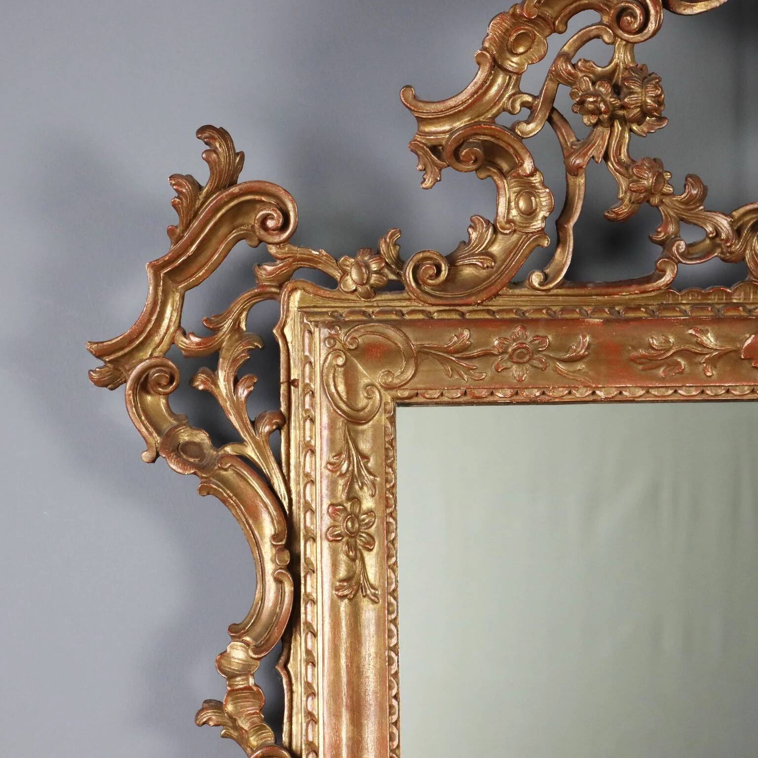 Antique carved and gilded wooden mirror, Italy, early 20th century.