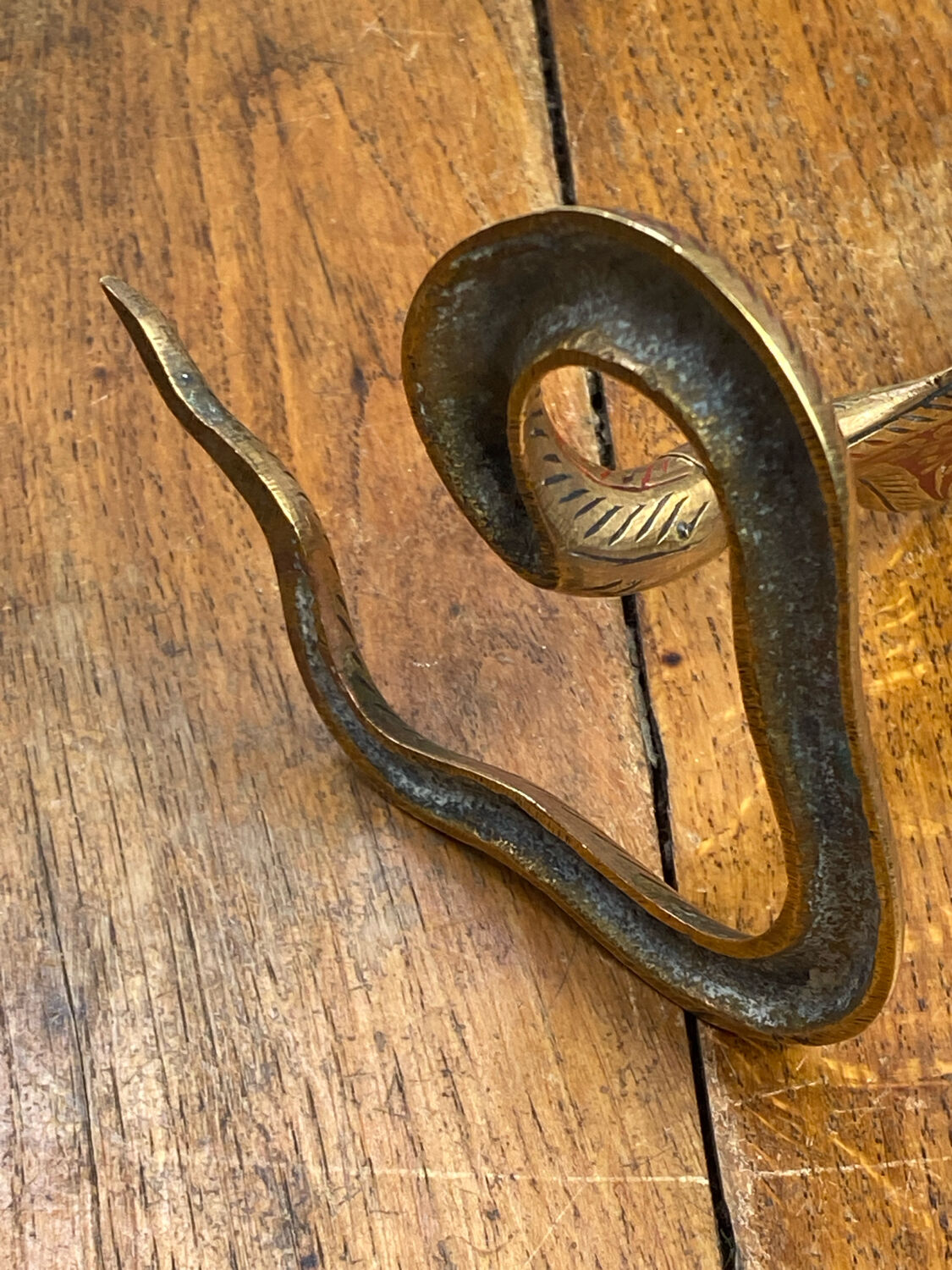 Chiseled brass cobra candlestick