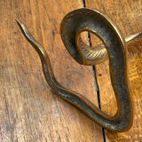 Chiseled brass cobra candlestick