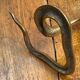 Chiseled brass cobra candlestick