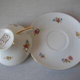 Old large tea cup and saucer in Limoges porcelain with flower decor