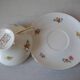 Old large tea cup and saucer in Limoges porcelain with flower decor