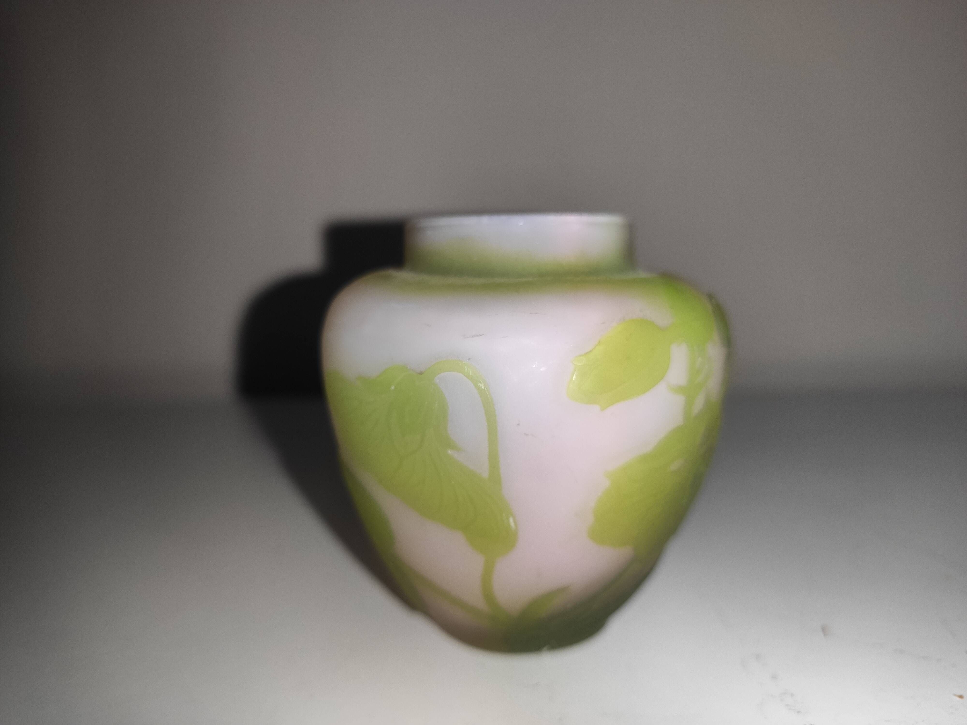 Small E. Gallé vase, "star" signature, light green tone on white background.