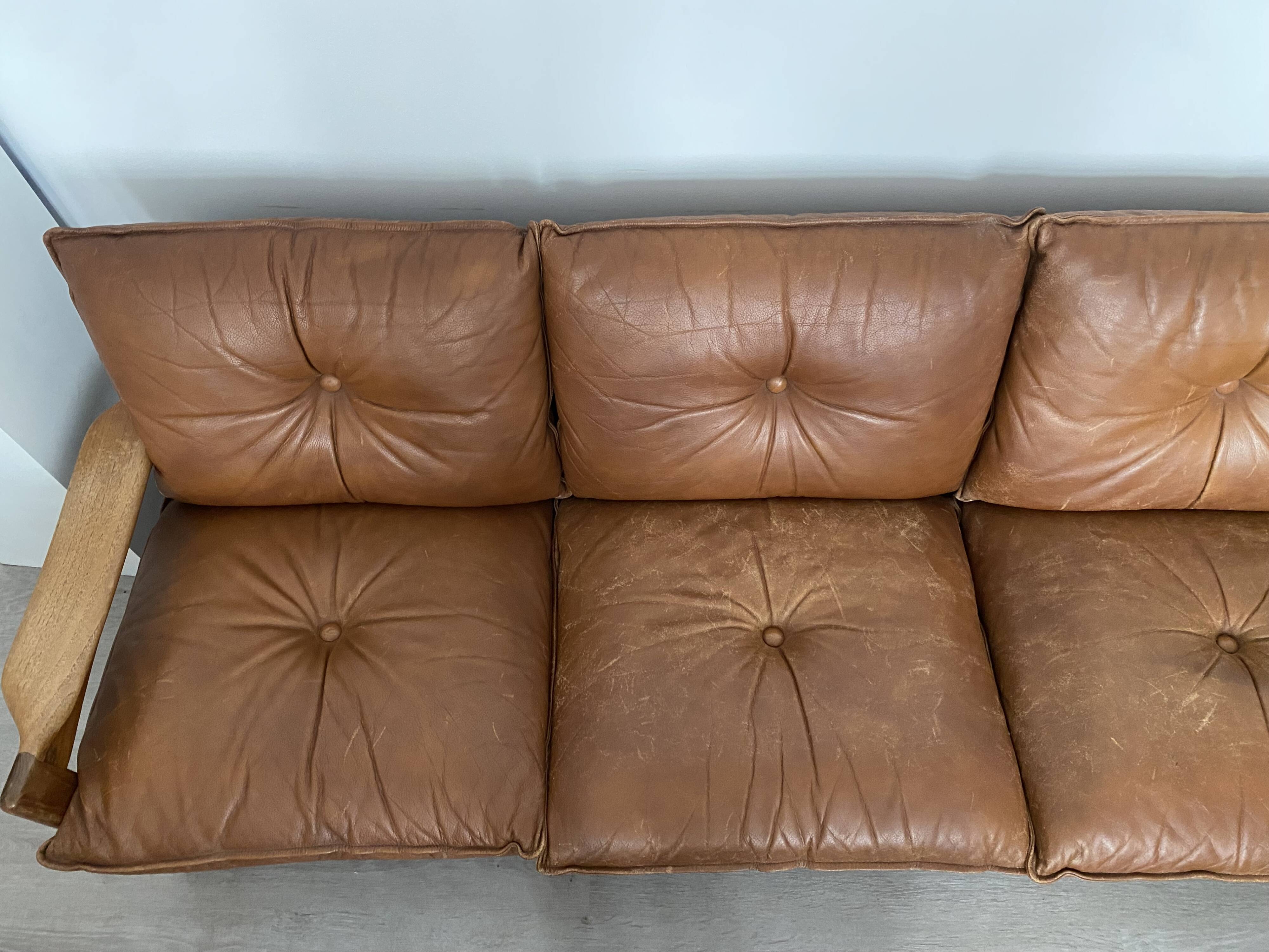 Scandinavian sofa in brown leather and solid wood