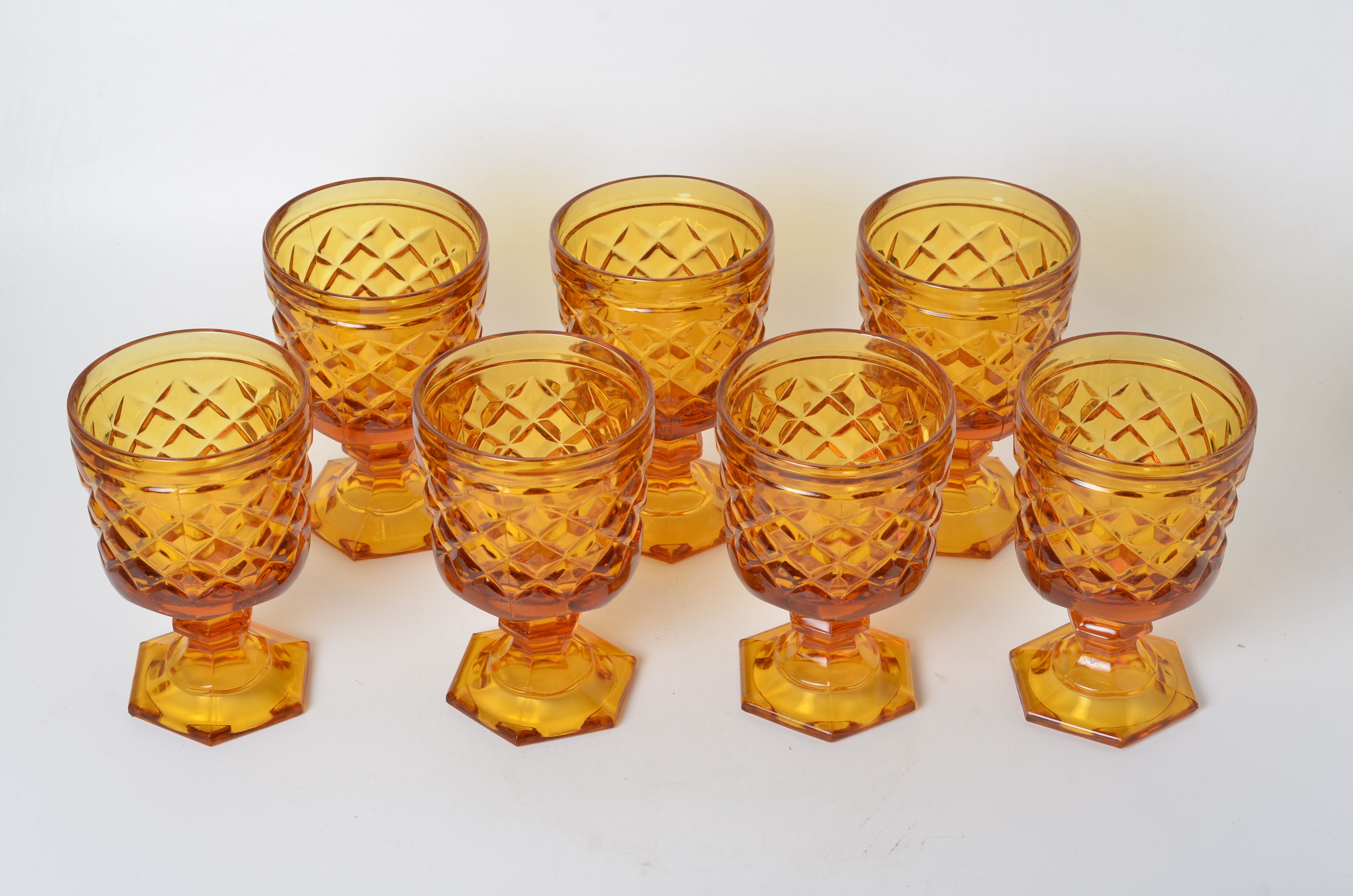 7 amber stemmed glasses