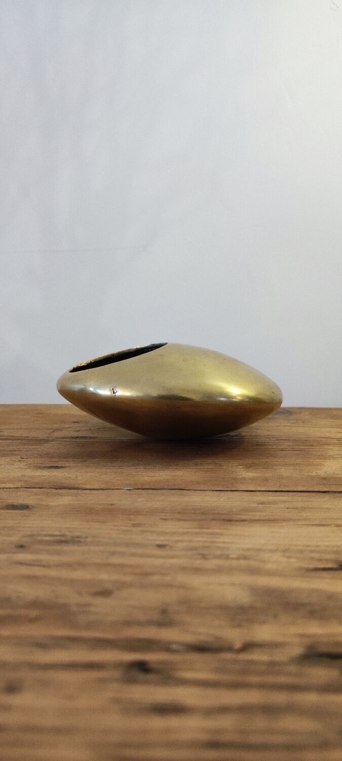 Modernist ashtray pellet in solid bronze.
