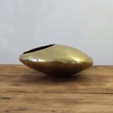 Modernist ashtray pellet in solid bronze.