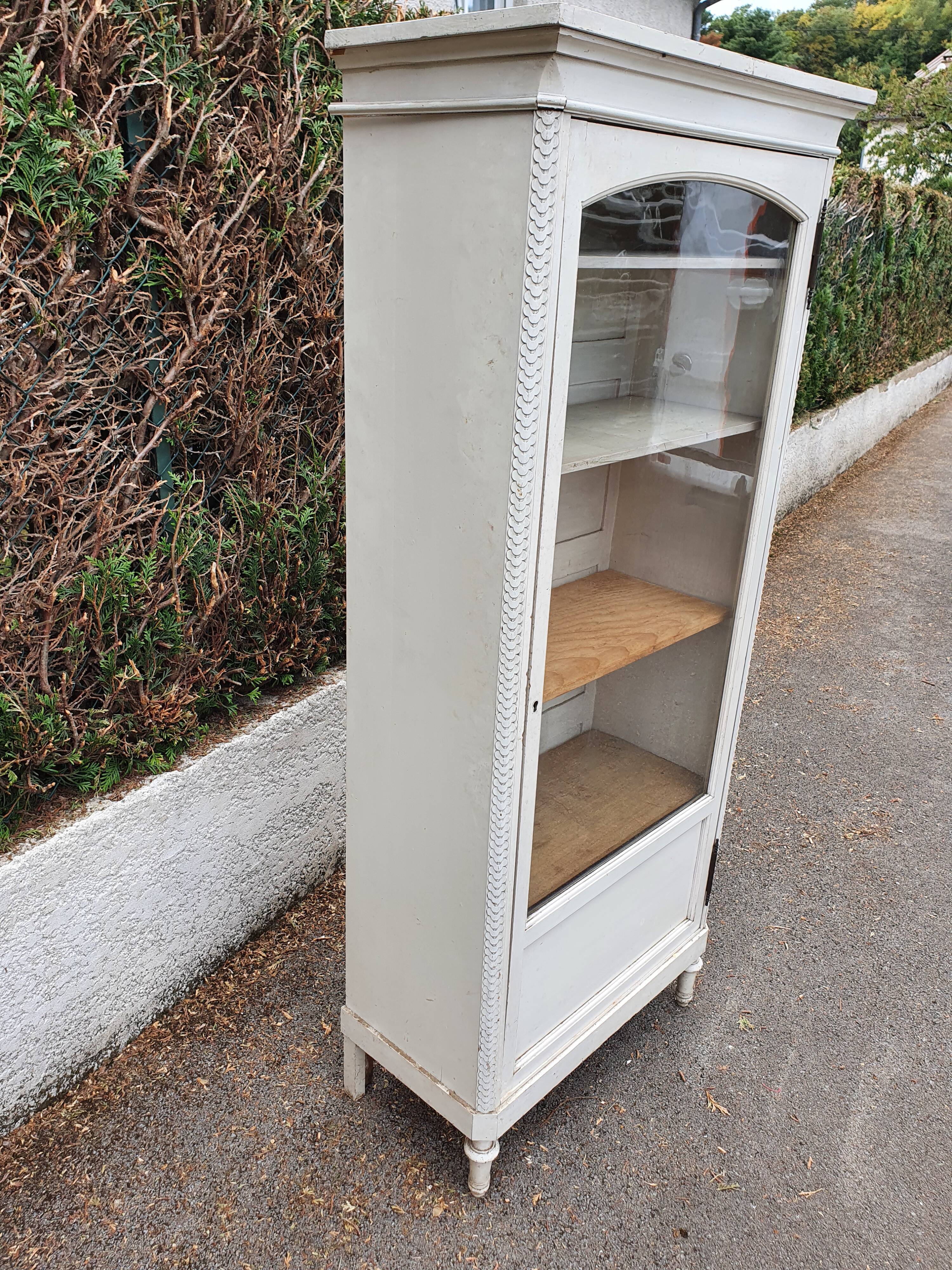 Old grey patinated showcase