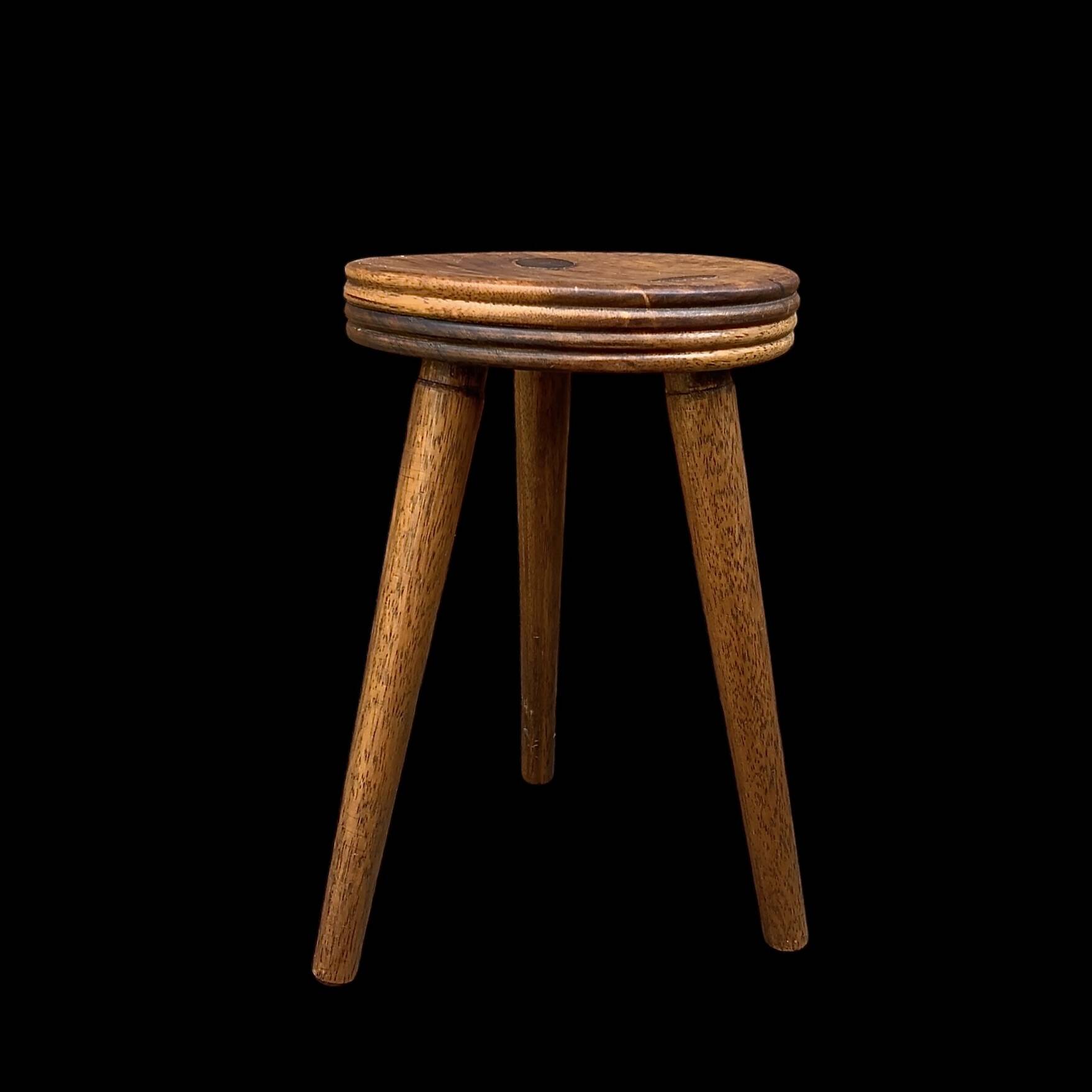 Old small wooden tripod stool