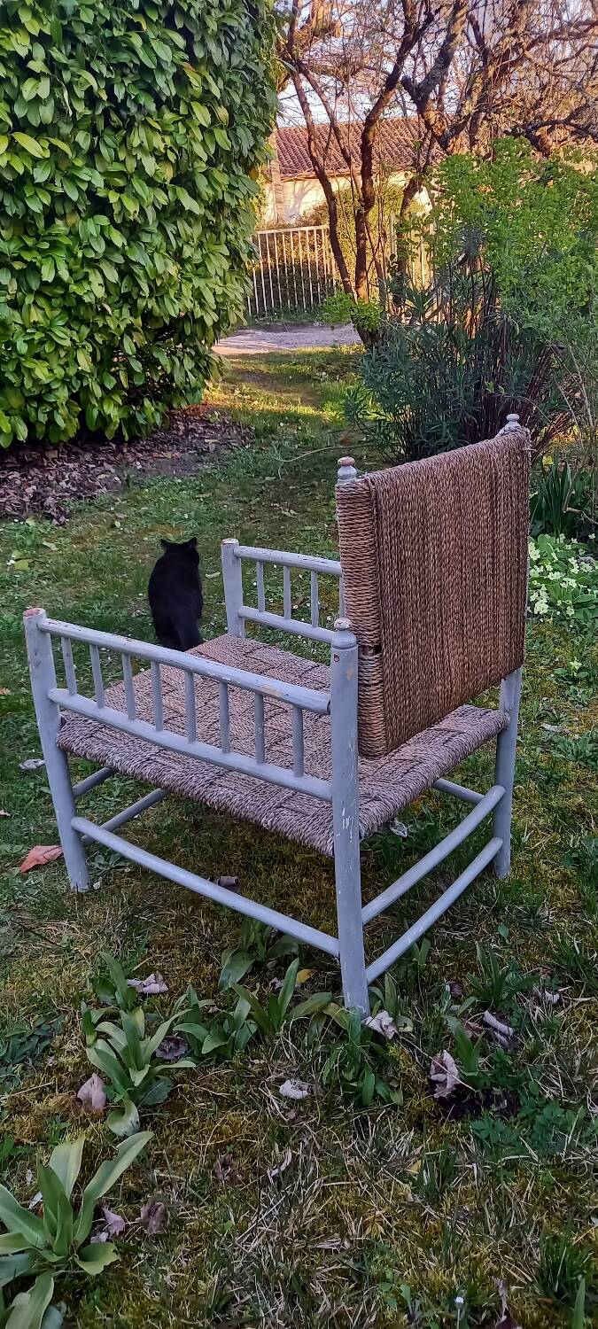 Rope-woven wooden armchair