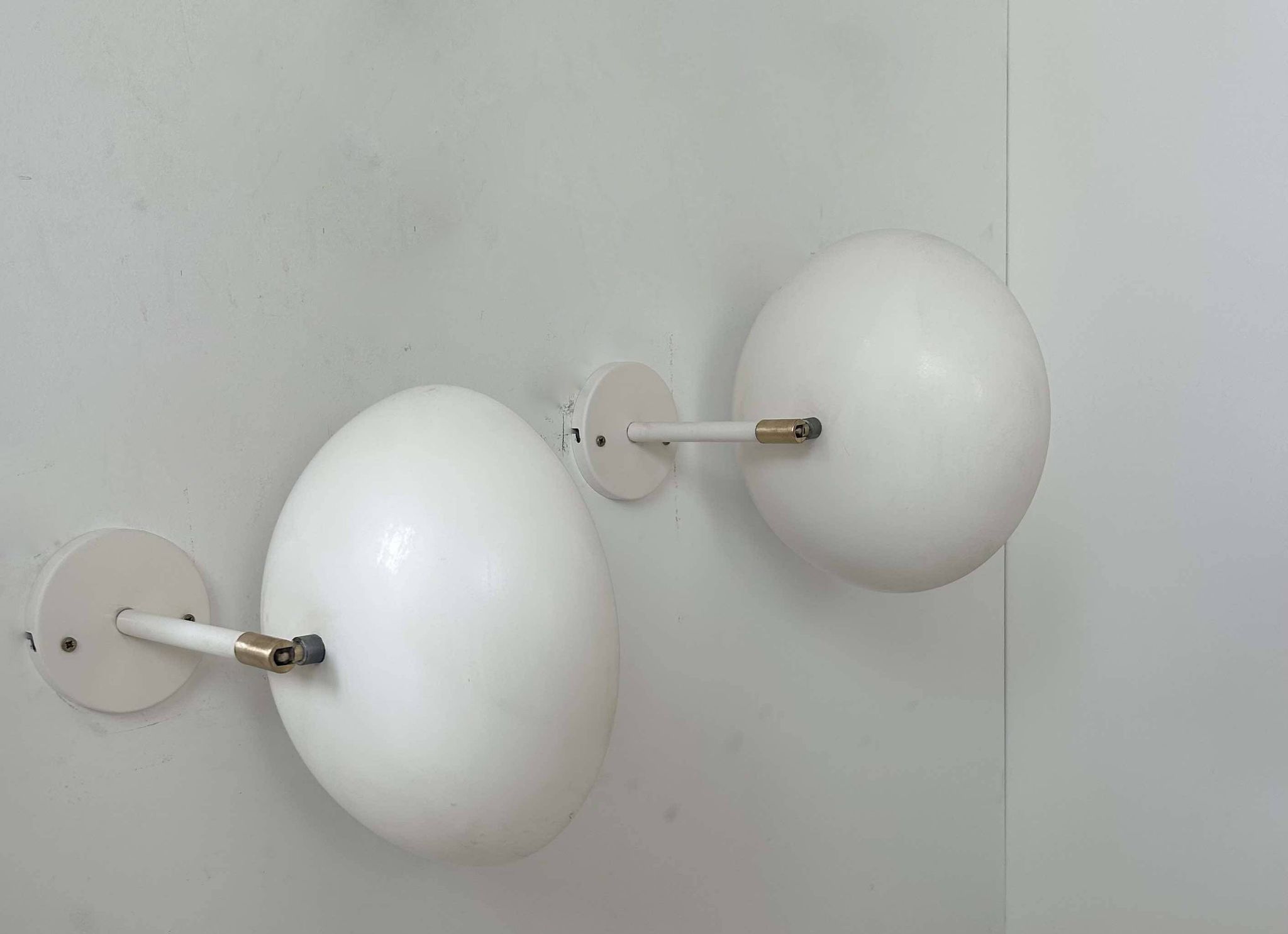 Pair of vintage adjustable wall lights, brass and white metal, France 1970