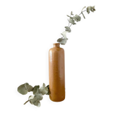 Old stoneware bottle with logo