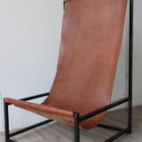 Pair of vintage armchairs in stretched leather and metal structure