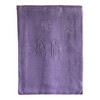 Old damask tablecloth in linen and purple silk