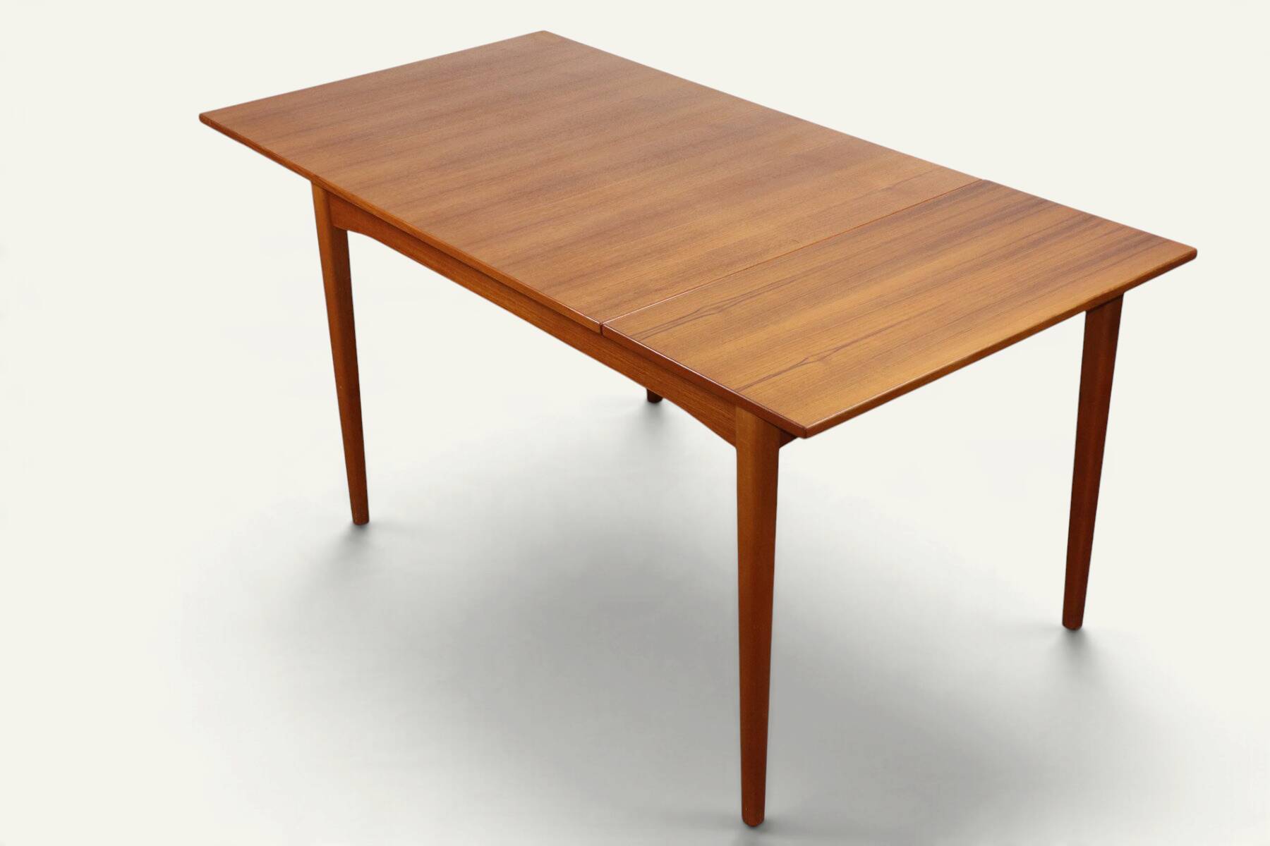 Rectangular extendable dining table in Scandinavian teak – 1960s