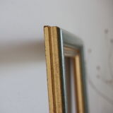 Frame in gilded and green wood