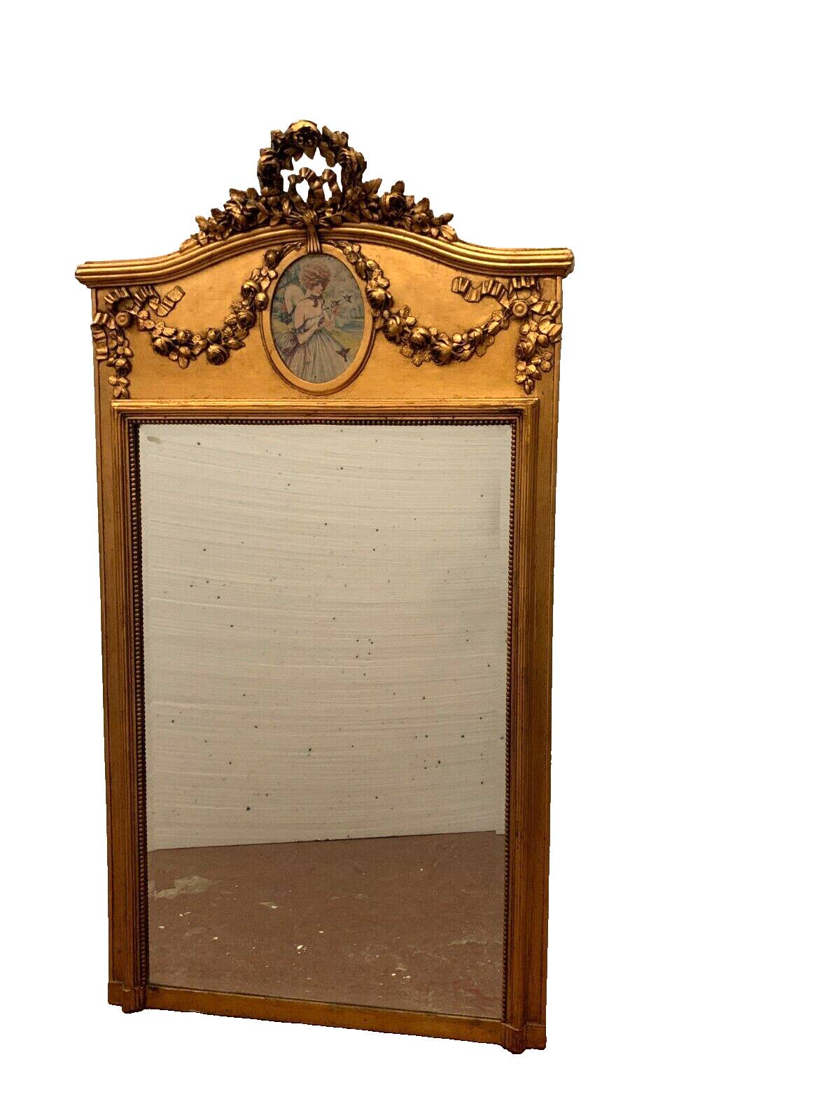 Louis XVI style mirror in wood and gilded stucco 20th century