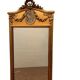 Louis XVI style mirror in wood and gilded stucco 20th century