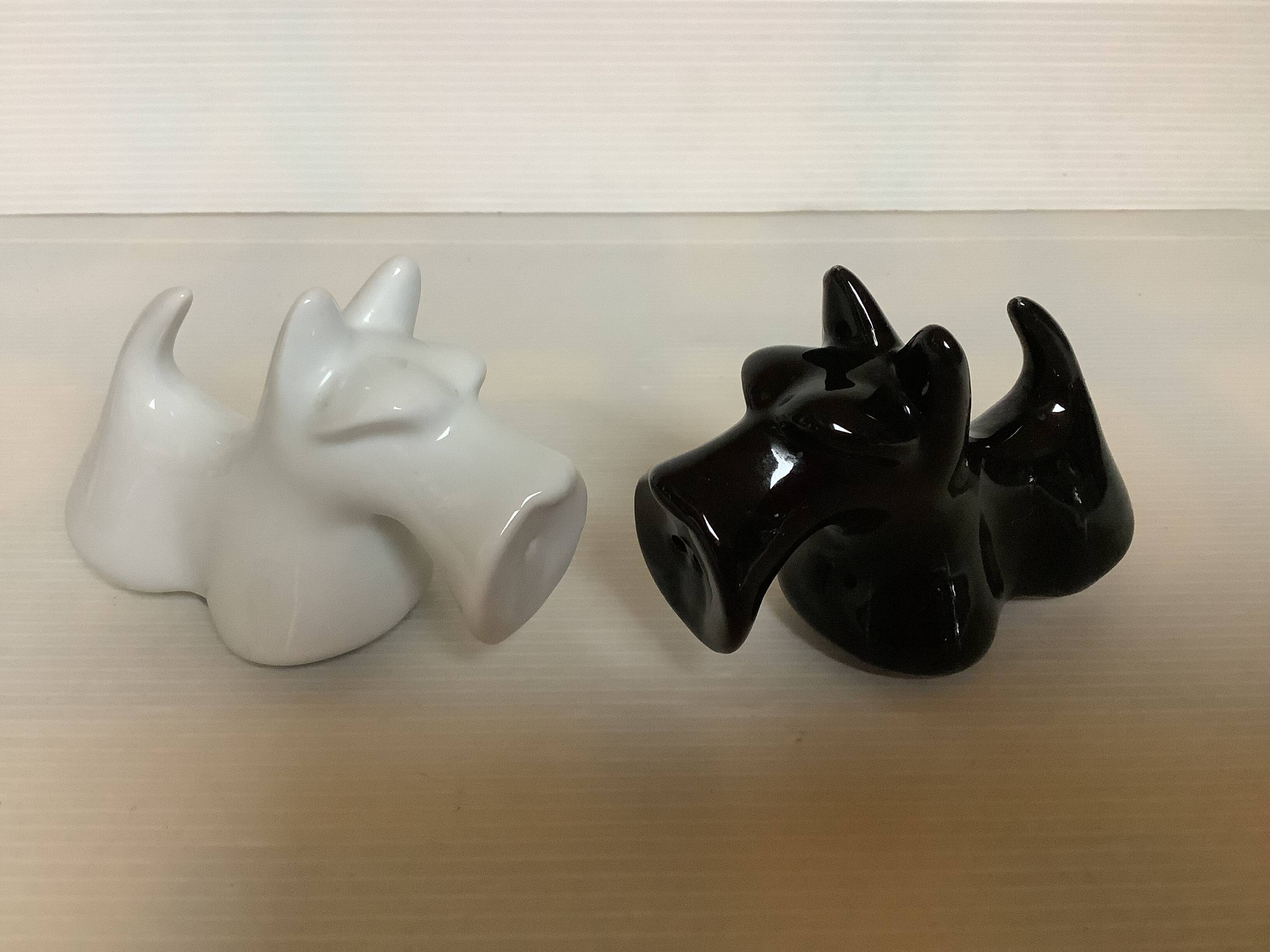 Salt and pepper black and white dogs.