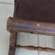 Vintage magazine rack in oak and antique leather