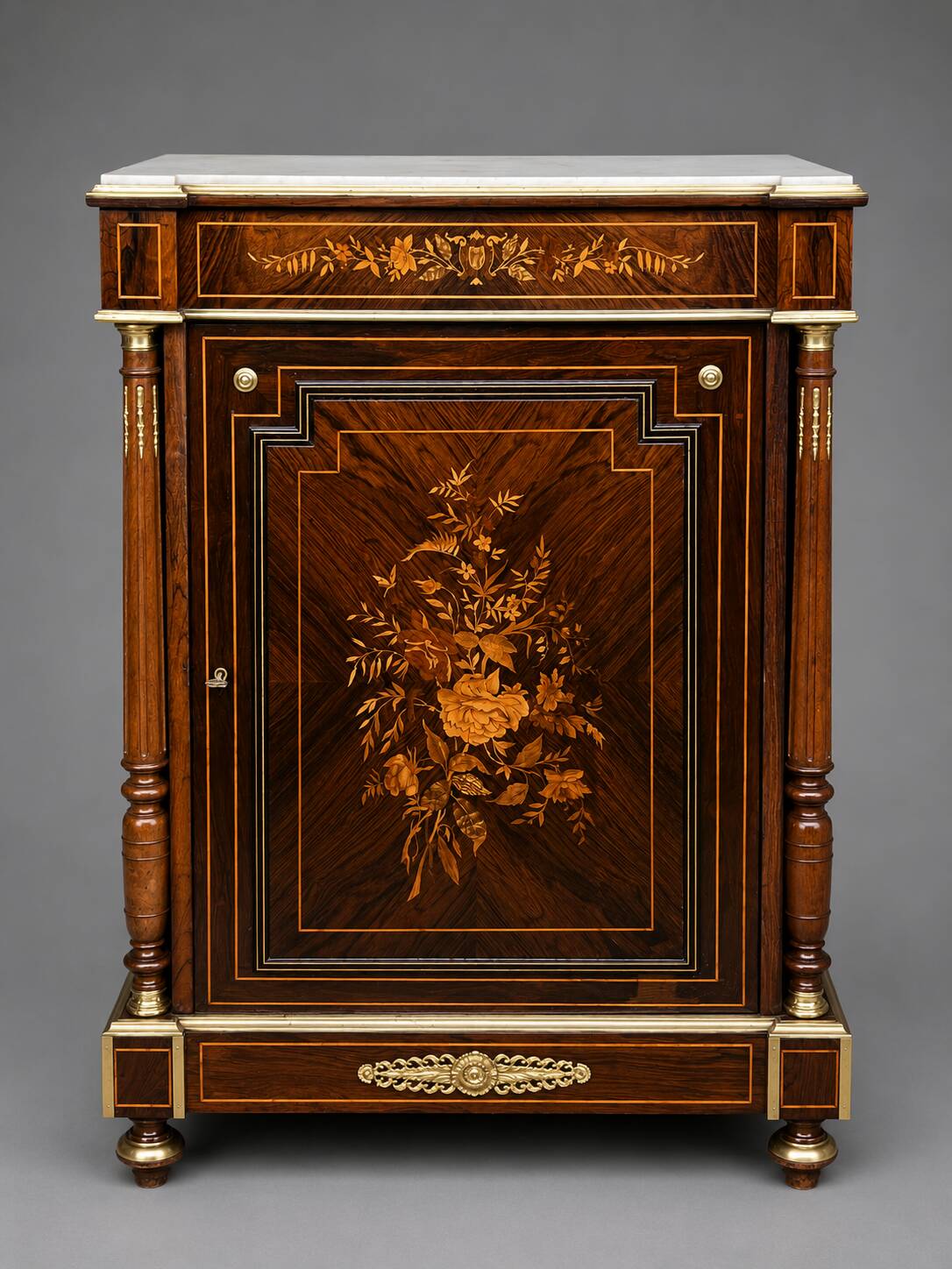 Elegant Napoleon III style commode with fine marquetry, gilded bronze mounts, and a marble top.