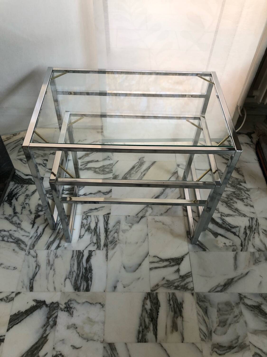 Nested tables in chrome metal and glass, Italy circa 1970.