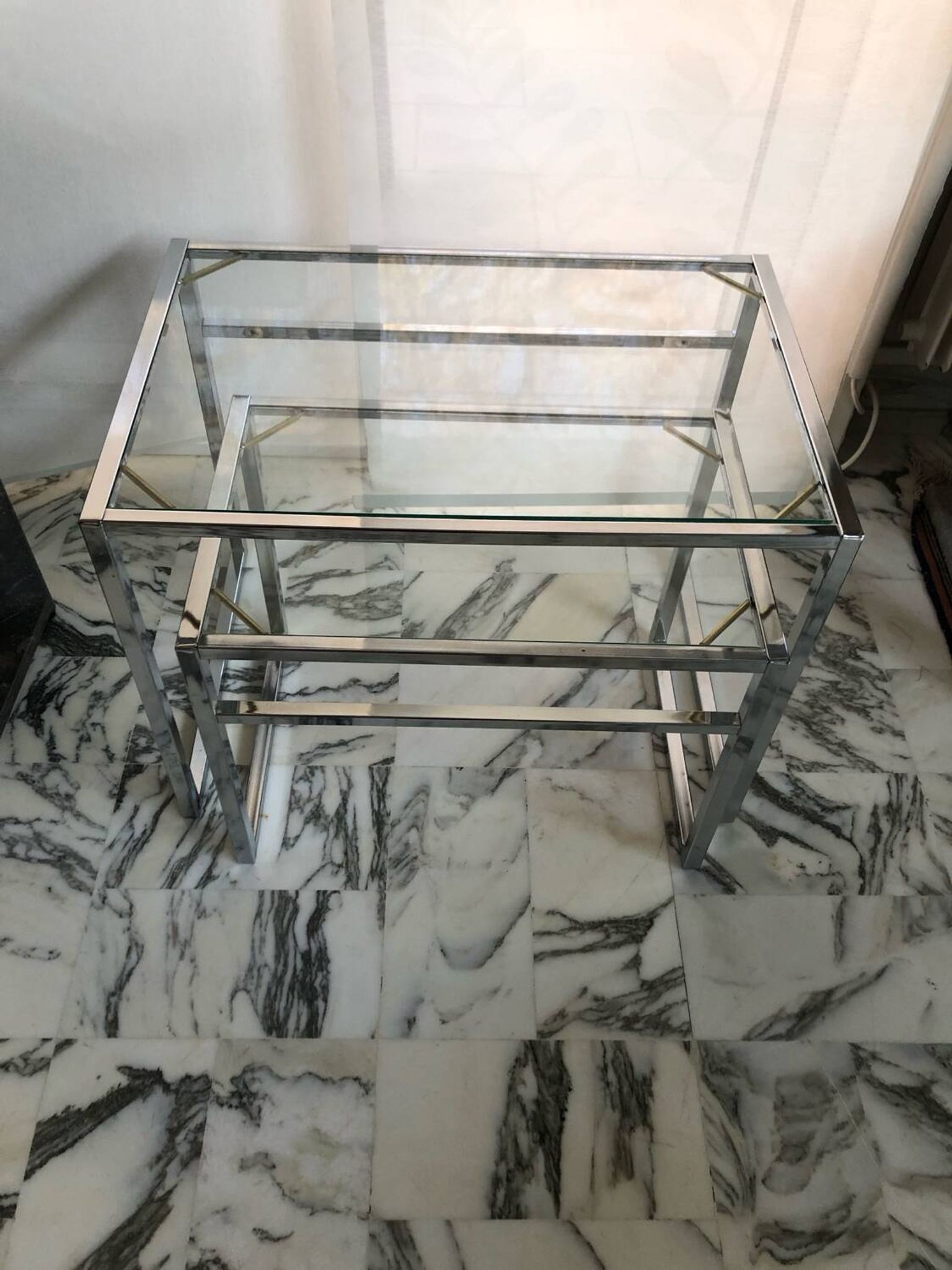Nested tables in chrome metal and glass, Italy circa 1970.