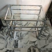Nested tables in chrome metal and glass, Italy circa 1970.