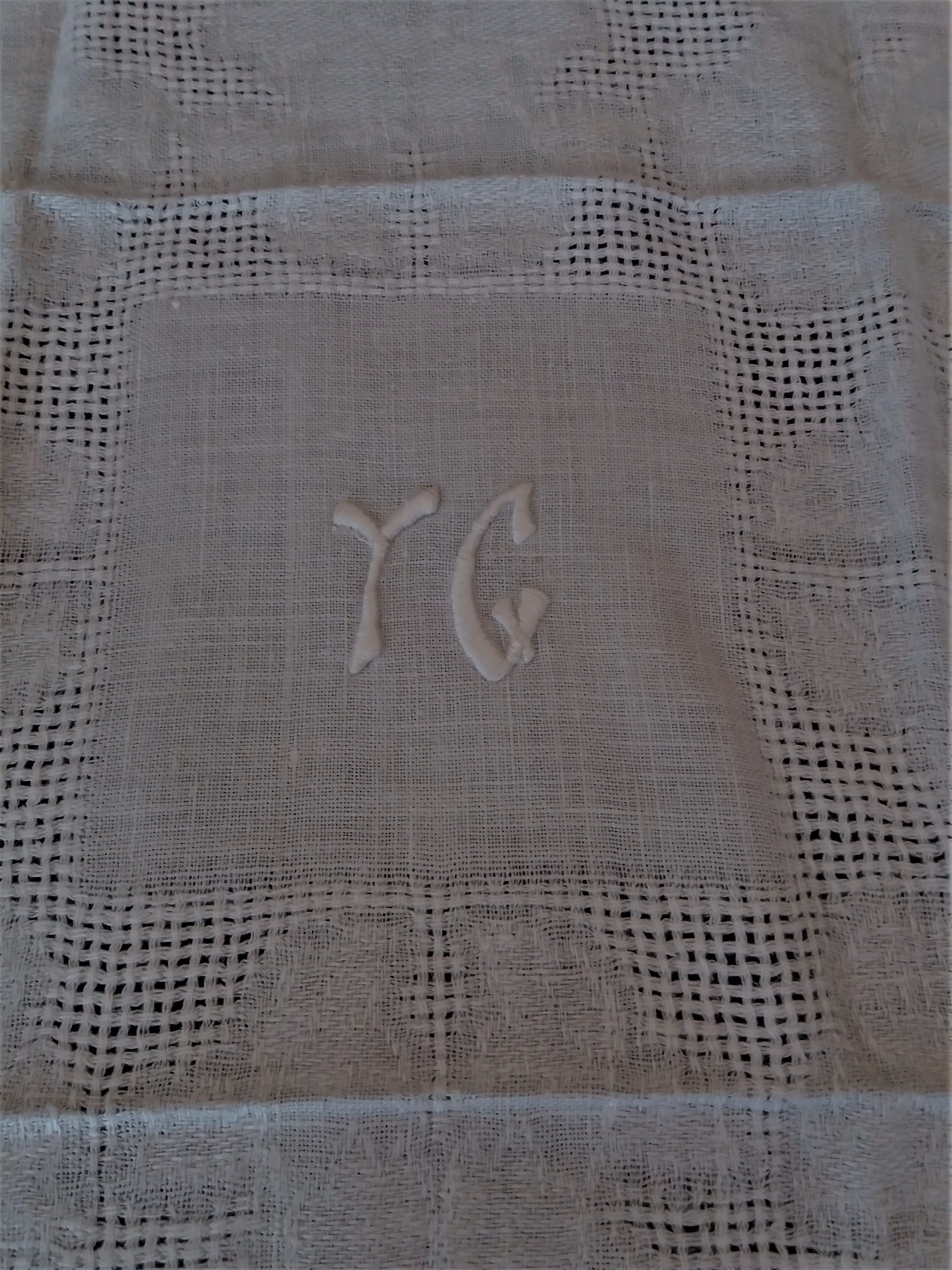 Series of six hand embroidered YG monogrammed YG linen table towels