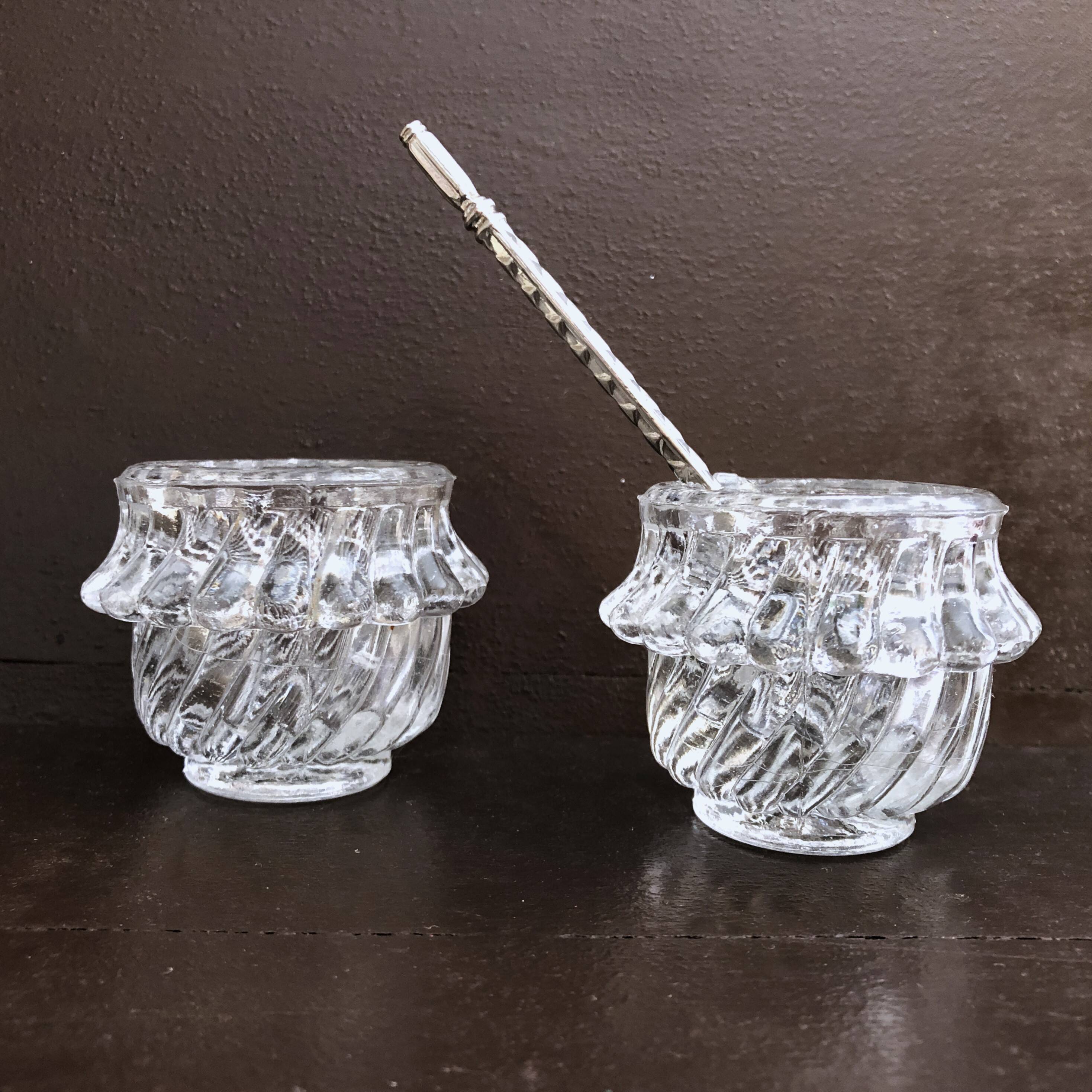 Glass salt and pepper shaker set with vintage serving spoon