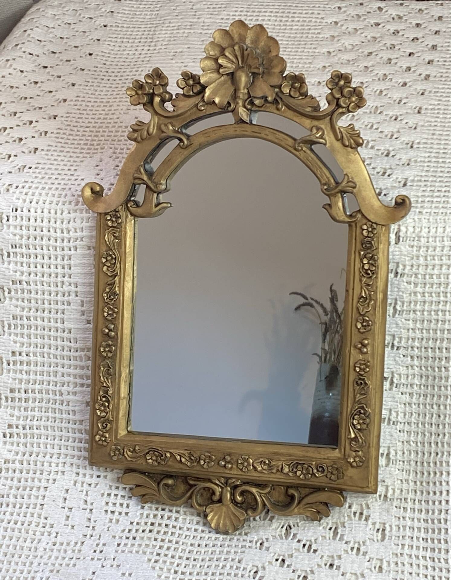 Baroque style mirror, decorated with shells and flowers.