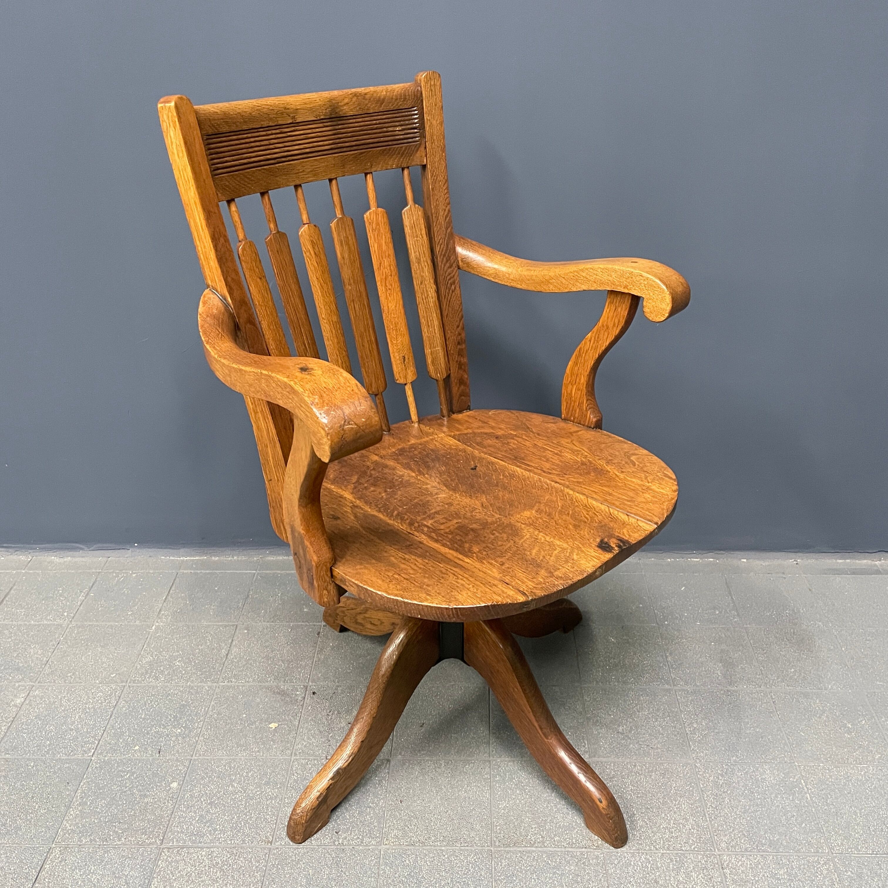 Antique American oak office chair with armrests 1920s