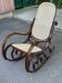 Vintage rocking chair made of curved solid wood and caned.