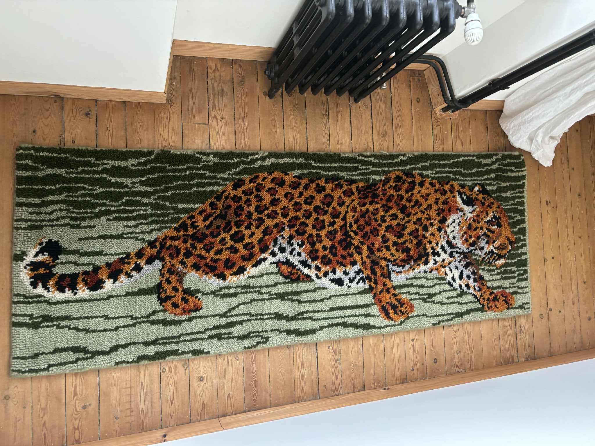 Vintage wool rug featuring a leopard (tiger)
