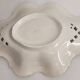 Openwork ceramic bowl with raised flower decoration in Italian style.