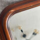 Vintage wooden framed mirror with bevelled glass.