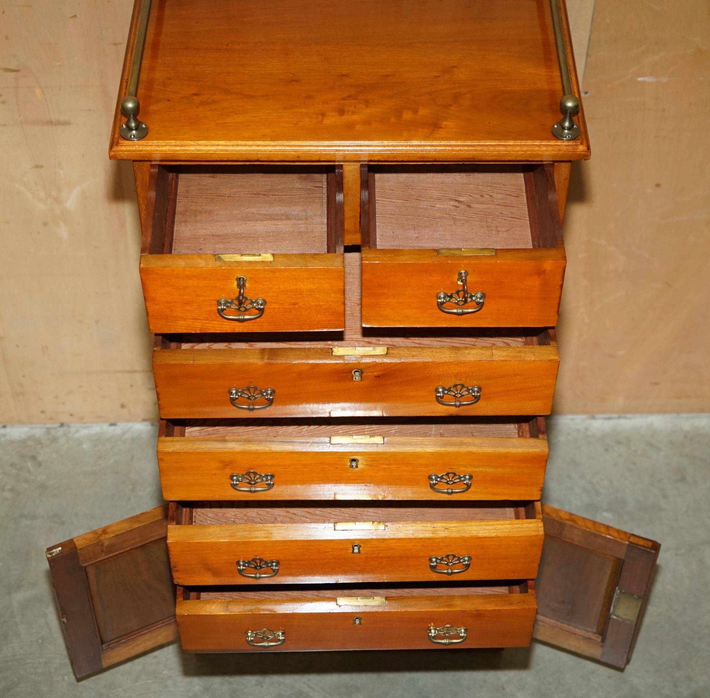 Victorian high chest of drawers in walnut with a bronze gallery.