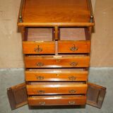 Victorian high chest of drawers in walnut with a bronze gallery.