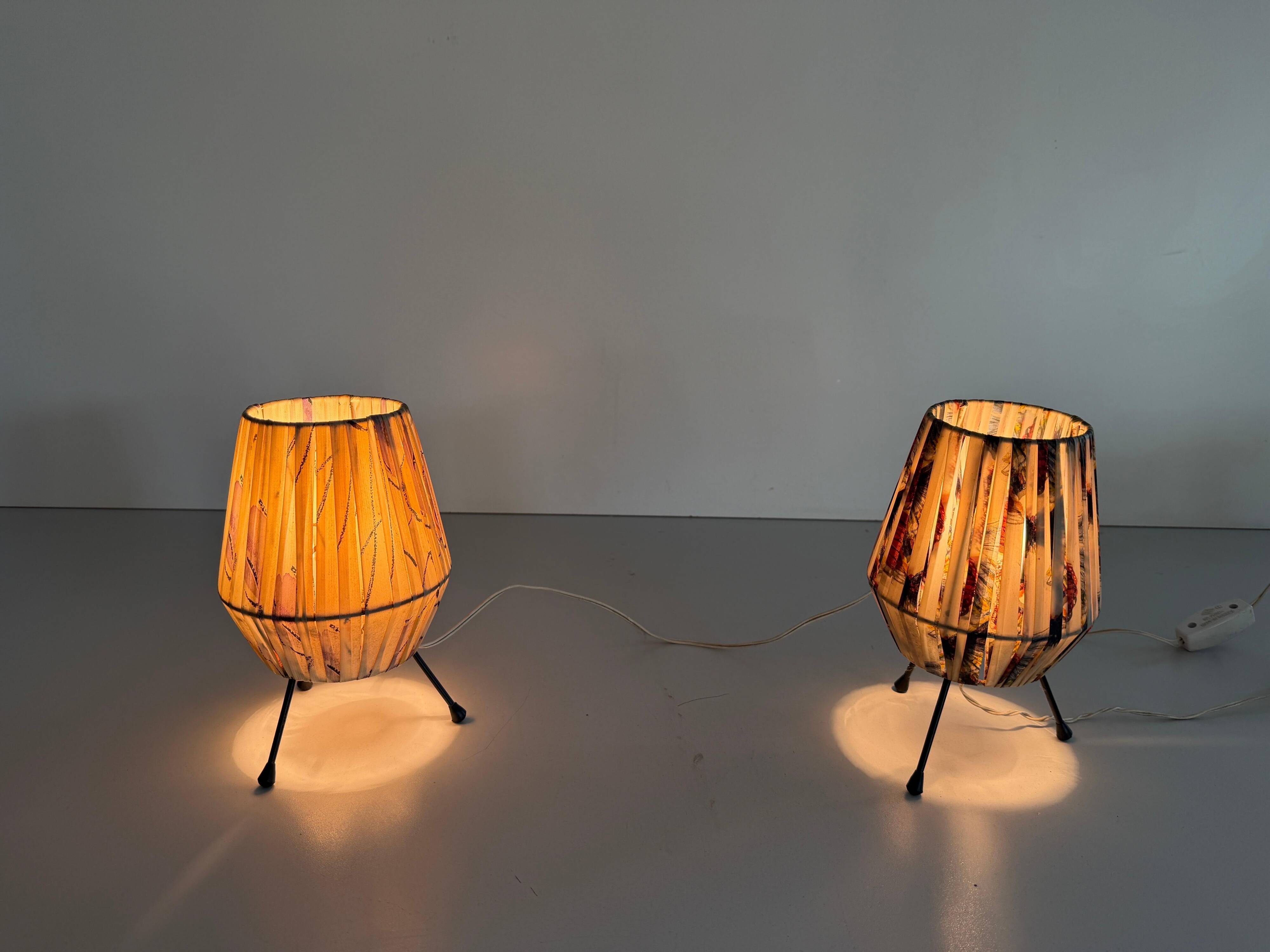 Pair of table lamps with plastic shades and tripod base, 1960s, Italy