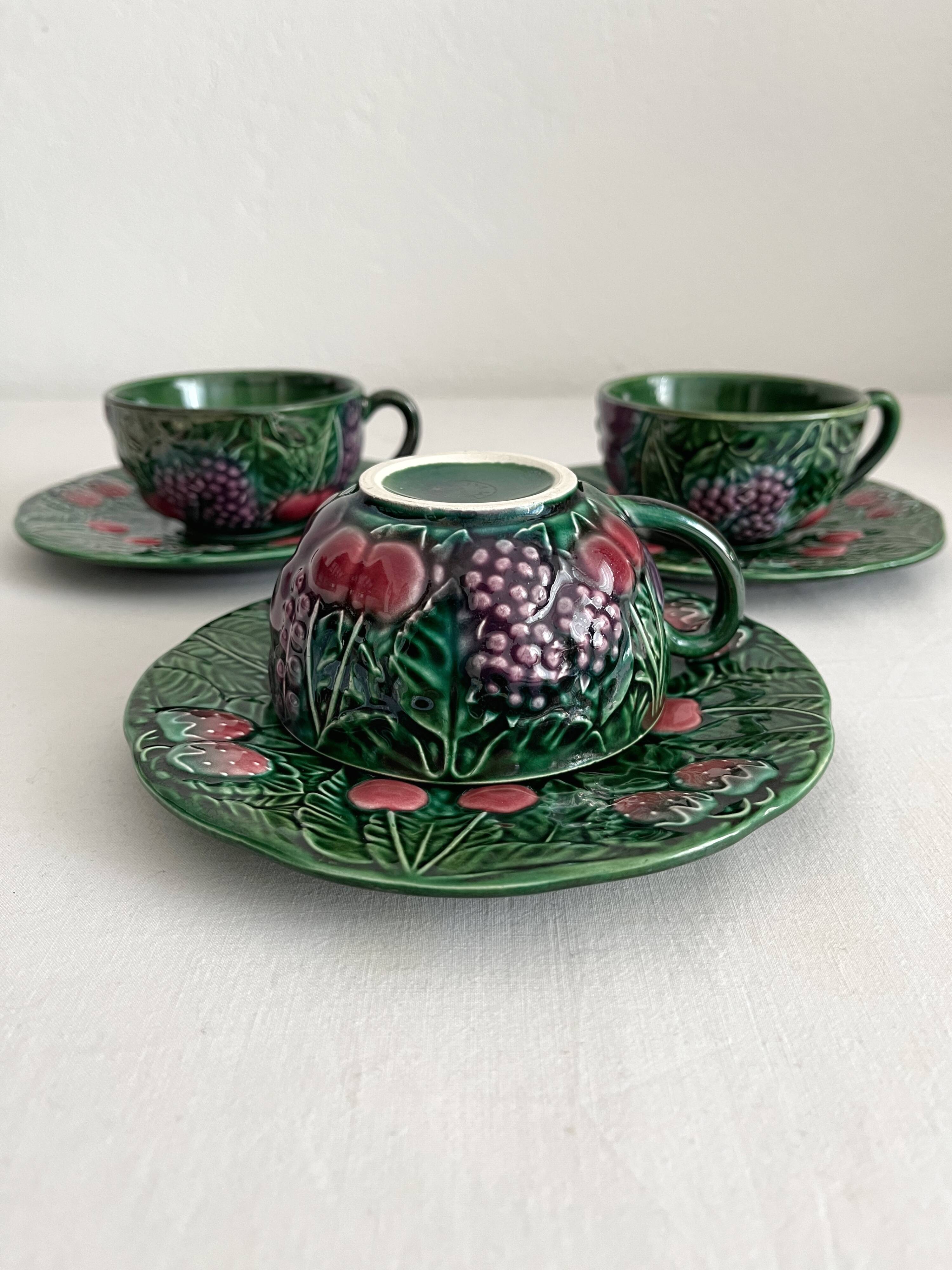 3 earthenware cups and saucers in barbotine fruit decor Salins vintage