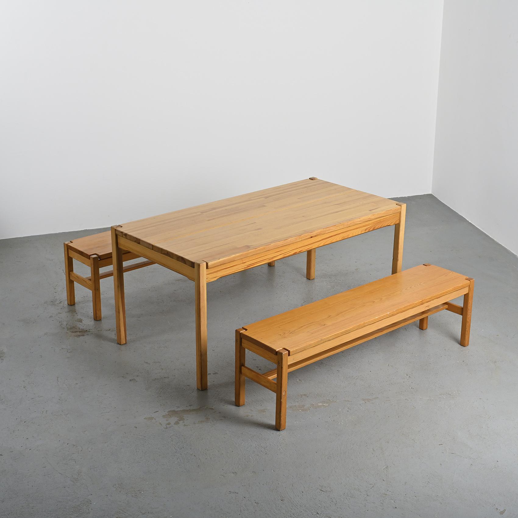 Table and two benches set in solid elm, France, circa 1980
