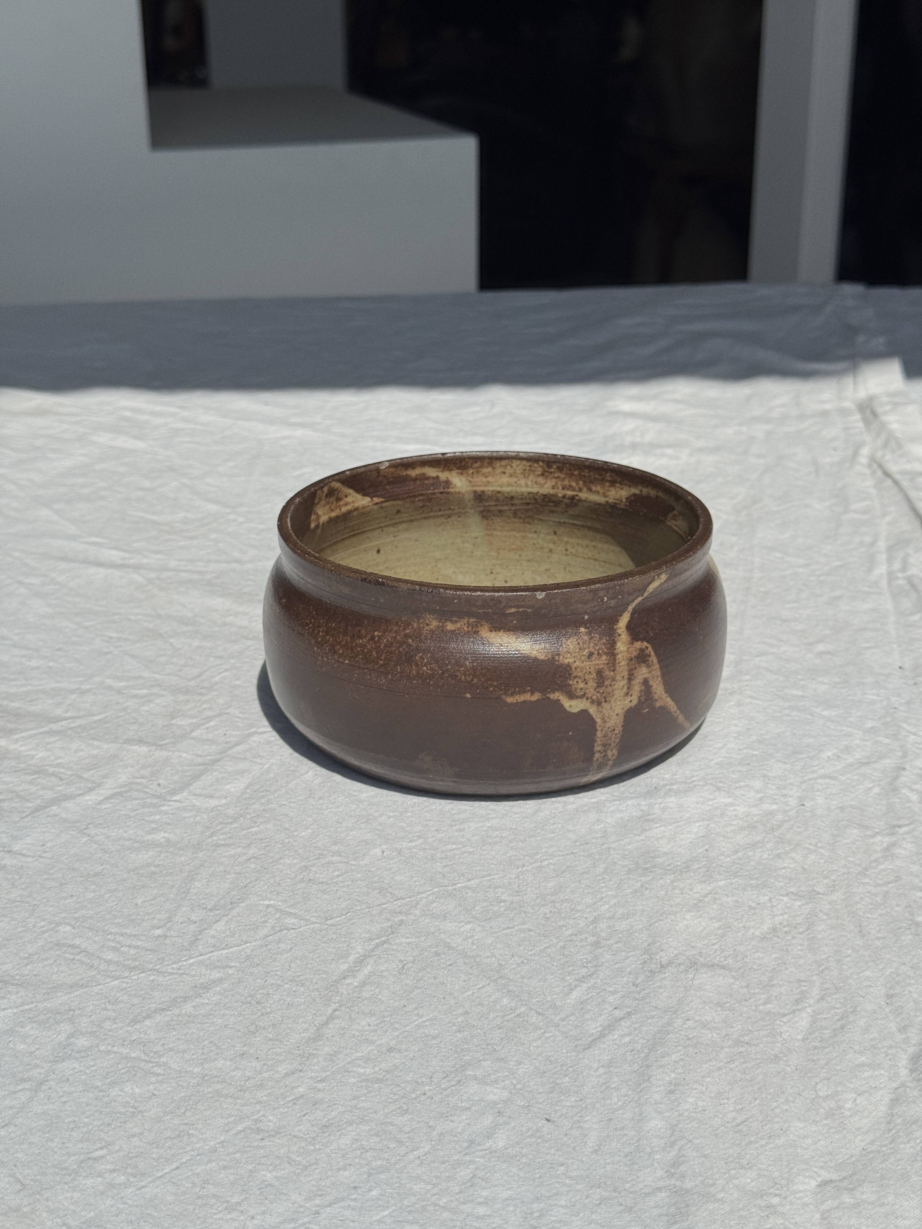 A small stoneware bowl, brown exterior, speckled grey interior D15