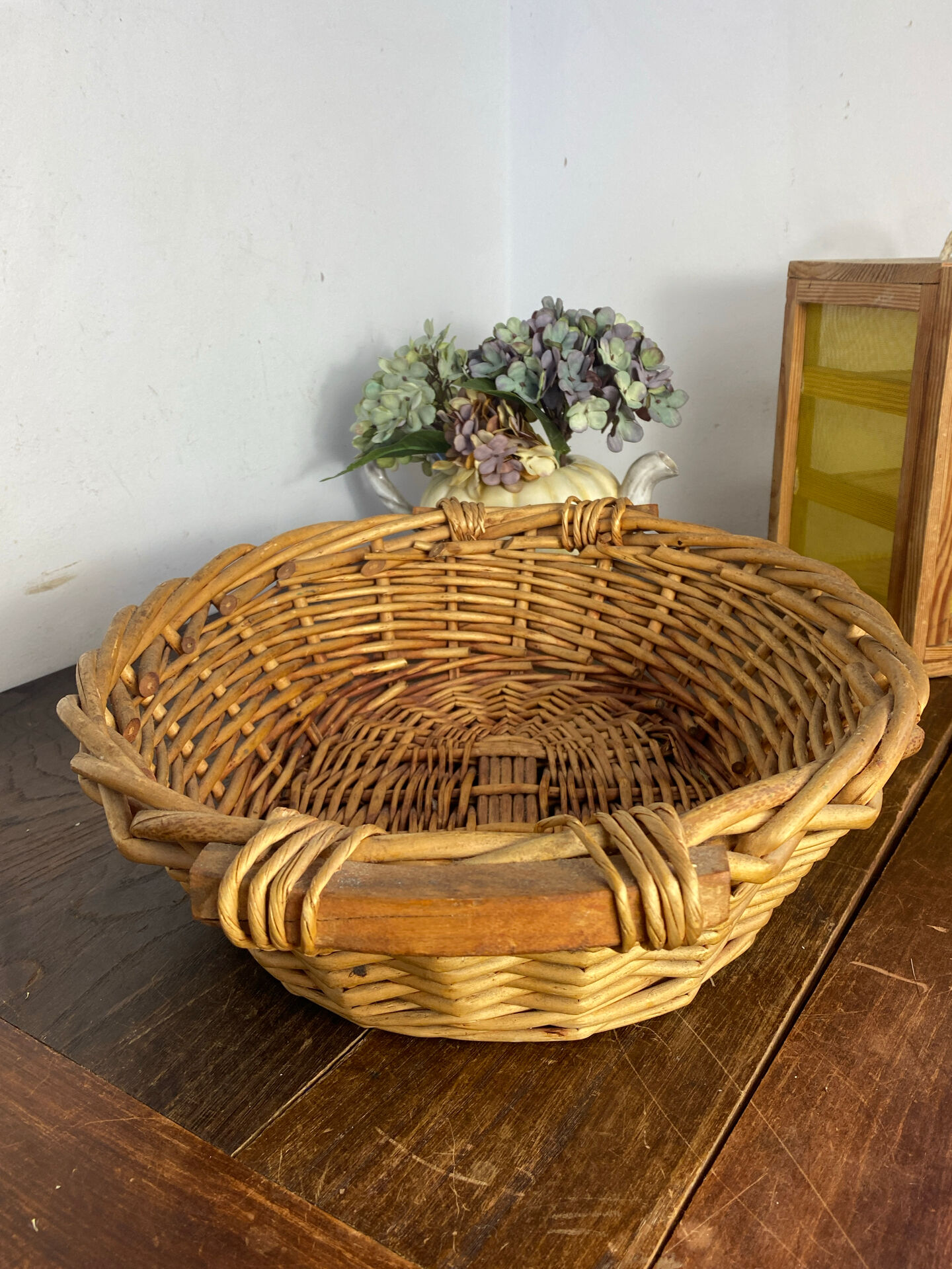 Wicker basket with wooden handles