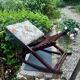 Folding footrest with vintage embroidery